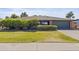 Charming single-story home with a well-maintained lawn, trimmed bushes, and a two-car garage at 12639 N 47Th Ave, Glendale, AZ 85304