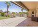 Covered patio featuring tile flooring, BBQ grill, and view of the swimming pool at 12639 N 47Th Ave, Glendale, AZ 85304