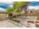 Desert backyard with a built-in fire pit, pavers, and covered patio at 12642 N Mountainside Dr # B, Fountain Hills, AZ 85268