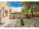 Desert backyard featuring a grill, covered patio, and paver path at 12642 N Mountainside Dr # B, Fountain Hills, AZ 85268