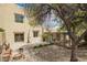 Backyard showcasing desert landscaping, a covered patio, and a paver path at 12642 N Mountainside Dr # B, Fountain Hills, AZ 85268