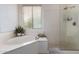 Large soaking tub next to a walk-in shower with glass enclosure at 12642 N Mountainside Dr # B, Fountain Hills, AZ 85268