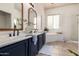Bright bathroom featuring a double vanity, soaking tub, and separate shower at 12642 N Mountainside Dr # B, Fountain Hills, AZ 85268