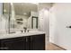 Well-lit bathroom featuring a dark vanity with bright countertop, modern fixtures, and ample storage at 12642 N Mountainside Dr # B, Fountain Hills, AZ 85268