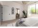 Cozy bedroom featuring natural light, view into the bathroom, and plant decor at 12642 N Mountainside Dr # B, Fountain Hills, AZ 85268