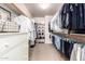 Spacious walk-in closet with ample storage and organization features at 12642 N Mountainside Dr # B, Fountain Hills, AZ 85268
