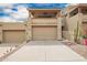 Attractive exterior elevation with a well-manicured yard, private patios, and an attached garage at 12642 N Mountainside Dr # B, Fountain Hills, AZ 85268