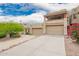 Beautiful exterior elevation with an attached garage, private balconies, and lush desert landscaping at 12642 N Mountainside Dr # B, Fountain Hills, AZ 85268