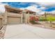 Inviting exterior elevation with attached garages, covered patios, and attractive desert landscaping at 12642 N Mountainside Dr # B, Fountain Hills, AZ 85268