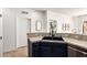 A kitchen with stainless steel appliances, dark cabinets, and stone countertops at 12642 N Mountainside Dr # B, Fountain Hills, AZ 85268