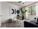 Cozy living room with a large window and indoor plants at 12642 N Mountainside Dr # B, Fountain Hills, AZ 85268