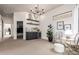 Bright living space featuring a dry bar, modern chandelier, and view into another room at 12642 N Mountainside Dr # B, Fountain Hills, AZ 85268