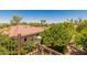 Scenic backyard view showcasing the lush landscaping, mature trees, and the peaceful neighborhood surroundings at 12837 N 68Th St, Scottsdale, AZ 85254