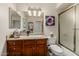 Bathroom vanity with a white sink, granite countertop, and a framed mirror at 12837 N 68Th St, Scottsdale, AZ 85254