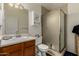 Cozy bathroom with a shower, single sink vanity, and tiled floors, offering a functional and private space at 12837 N 68Th St, Scottsdale, AZ 85254