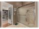 The bathroom has a large shower with a glass door, tiled walls, and a walk-in closet at 12837 N 68Th St, Scottsdale, AZ 85254