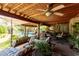Inviting covered patio with swing and lounge seating overlooking the pool area, perfect for relaxation at 12837 N 68Th St, Scottsdale, AZ 85254