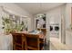 Bright dining area with a view of the laundry room and natural light at 12837 N 68Th St, Scottsdale, AZ 85254