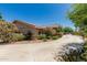 The home's exterior is complemented by lush landscaping, vibrant flowers, and a serene, welcoming atmosphere at 12837 N 68Th St, Scottsdale, AZ 85254
