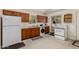Functional kitchen with ample cabinet space, a modern refrigerator, and essential appliances, perfect for everyday cooking at 12837 N 68Th St, Scottsdale, AZ 85254