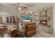 Cozy living room boasts a stone fireplace, built-in shelves, and comfortable seating at 12837 N 68Th St, Scottsdale, AZ 85254