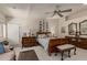 This main bedroom has a sitting area, carpeted floors, a ceiling fan, and plenty of storage at 12837 N 68Th St, Scottsdale, AZ 85254