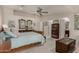 This main bedroom features a sitting area, carpeted floors, and an ensuite bathroom at 12837 N 68Th St, Scottsdale, AZ 85254