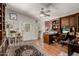 Office with hardwood floors, built-in cabinets, desk, and a cat tree at 12837 N 68Th St, Scottsdale, AZ 85254