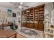 Office with hardwood floors, built-in shelving, and an oriental rug at 12837 N 68Th St, Scottsdale, AZ 85254