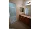 Bathroom with marble countertops and a tiled shower/tub combo at 14376 W Desert Hills Dr, Surprise, AZ 85379