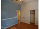 This bedroom has fresh paint, fan, closet, and hardwood floors at 14376 W Desert Hills Dr, Surprise, AZ 85379