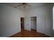 Bright bedroom showcasing a ceiling fan, closet, and neutral colors at 14376 W Desert Hills Dr, Surprise, AZ 85379