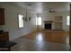 Open living space featuring wood floors, lots of light, and a fireplace at 14376 W Desert Hills Dr, Surprise, AZ 85379