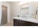 Bright bathroom with a marble vanity, modern mirror, and tiled floors offer a spa-like experience at 1622 N 17Th Ave, Phoenix, AZ 85007