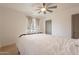 Bedroom featuring neutral walls, light wood floors, a ceiling fan, and large windows at 1622 N 17Th Ave, Phoenix, AZ 85007
