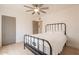 Bright bedroom featuring neutral walls, light wood floors, a ceiling fan, and closet at 1622 N 17Th Ave, Phoenix, AZ 85007