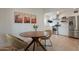 Dining area showcasing a wooden table and stylish chairs adjacent to the kitchen at 1622 N 17Th Ave, Phoenix, AZ 85007