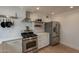 Modern kitchen with stainless steel appliances, white cabinets, and ample counter space at 1622 N 17Th Ave, Phoenix, AZ 85007