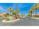 Welcome to The Retreat! This community entrance has lush landscaping, mature trees, and a security gate at 18226 W Stinson Dr, Surprise, AZ 85374