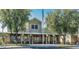 Exterior of community building with an American flag, trees, and seating at 18226 W Stinson Dr, Surprise, AZ 85374