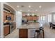 Well-appointed kitchen with granite countertops, stainless steel appliances, large island, and ample cabinet space at 18226 W Stinson Dr, Surprise, AZ 85374