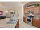 Charming kitchen featuring stainless steel appliances, granite counters, and ample storage, perfect for culinary enthusiasts at 18226 W Stinson Dr, Surprise, AZ 85374