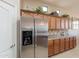 Bright kitchen featuring stainless steel refrigerator and plentiful cabinetry at 18226 W Stinson Dr, Surprise, AZ 85374