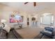 Bright and open living room with a large TV, comfortable seating, and a view of the breakfast bar at 18226 W Stinson Dr, Surprise, AZ 85374