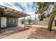 Relaxing backyard featuring covered patio, brick accent, and a comfortable hammock at 2019 W Stella Ln, Phoenix, AZ 85015