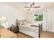 Cozy bedroom with decorative bed frame, wood floors, and natural light at 2019 W Stella Ln, Phoenix, AZ 85015
