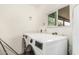 Clean laundry room with modern washer and dryer, and natural light at 2019 W Stella Ln, Phoenix, AZ 85015