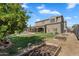 Expansive backyard with a pool, a covered patio, and a garden with a trellis at 21266 S 213Th Pl, Queen Creek, AZ 85142