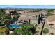 Spacious backyard featuring a pool, covered patio, playset, and garden beds at 21266 S 213Th Pl, Queen Creek, AZ 85142