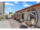 Secluded backyard patio with gravel, a hanging egg chair, and decorative plants at 21266 S 213Th Pl, Queen Creek, AZ 85142